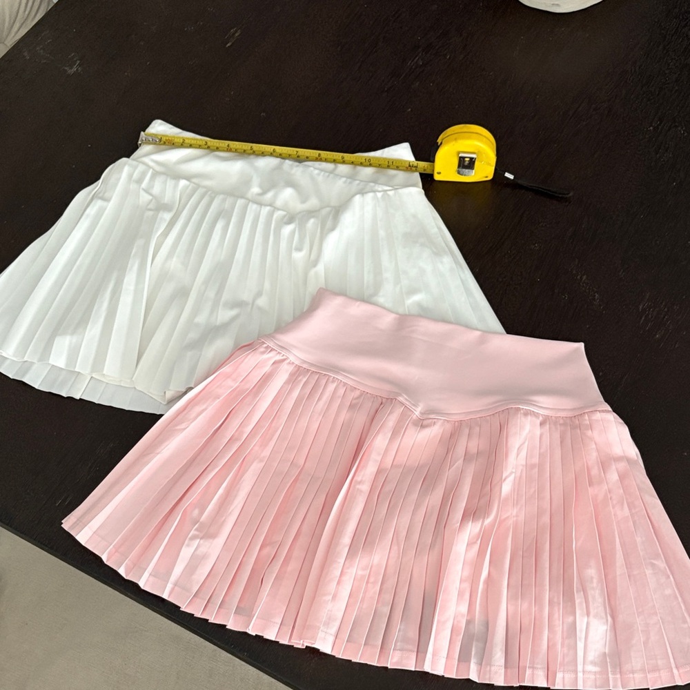 Pleated tennis skirts. White s small, pink s 4. Pink and White Pleated Skirt Set